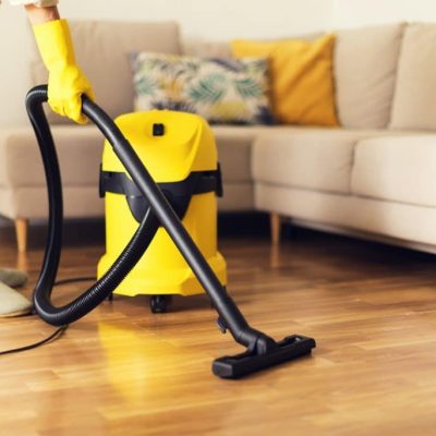 woman-cleaning-sofa-with-yellow-vacuum-cleaner-copy-space-cleaning-service-concept-1024x684