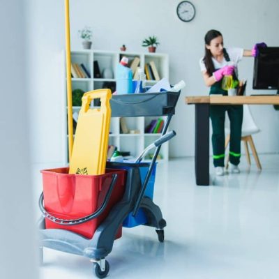 young-female-janitor-cleaning-office-with-various-cleaning-equipment-1024x684