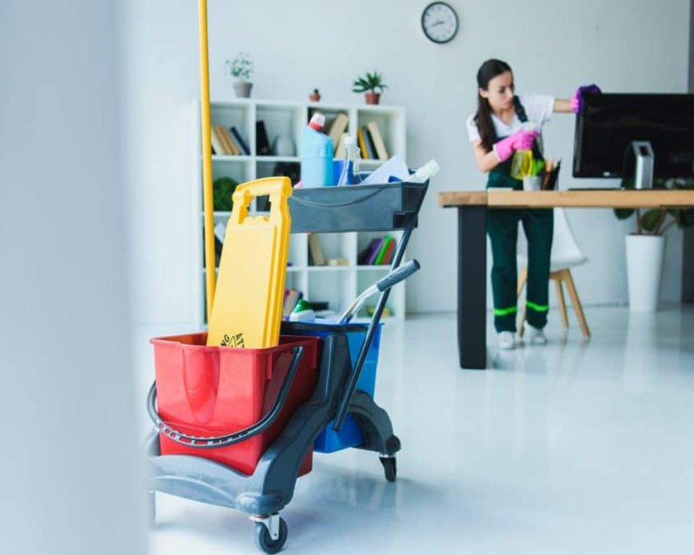 young-female-janitor-cleaning-office-with-various-cleaning-equipment-1024x684